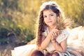 Gorgeous young girl holding up a bundle of wheat and tutu skirt