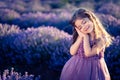 Gorgeous young girl imitating sleeping position in the lavender field