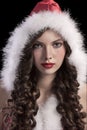 Gorgeous young girl with a santa hood
