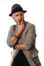 Gorgeous young man in hat and jacket looking away with open mouth Royalty Free Stock Photo