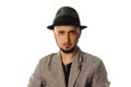 Gorgeous young man in hat and jacket looking at the camera Royalty Free Stock Photo