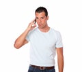 Gorgeous young man speaking on his cellphone Royalty Free Stock Photo