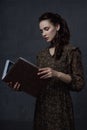 a gorgeous young woman with a book in her hands Royalty Free Stock Photo