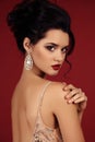 Gorgeous young woman with dark hair in luxurious dress Royalty Free Stock Photo