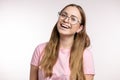 Gorgeous young woman is laughing as she has listened to a funny joke Royalty Free Stock Photo