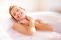 This is simply amazing. A gorgeous young woman lying in a luxurious bath of rose petals.