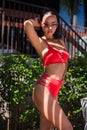 Gorgeous young woman posing in bikini near pool Royalty Free Stock Photo