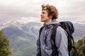 Gorgeouse backpacker is looking at the mountain