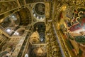 Gorgeously decorated altar and frescoes on walls in the interior of Holy Dormition Cathedral in Pechersk Lavra, Kyiv