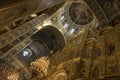 Gorgeously decorated golden altar and frescoes on the walls in interior of Holy Dormition Cathedral in Pechersk Lavra