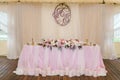 Gorgeously decorated newlyweds table with monogram under it