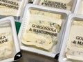 Gorgonzola and mascarpone cheese slices in plastic packaging Royalty Free Stock Photo