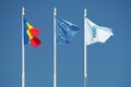 Gorj County, European Union and Romania. Flags on blue sky.