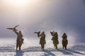 Golden eagle during the winter Mongolia local men riding on horses around the mountains covered with snow Royalty Free Stock Photo