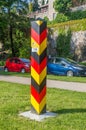 Tricolor of German territorial sign. Border post on the border between Germany and Poland