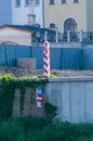 View from German site to white and red of Polish territorial sign. Border post on the border between Germany and Poland