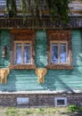 GORODETS, RUSSIA - APRIL 17, 2023: A fragment of a wooden turquoise house with carved platbands