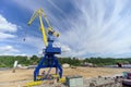 Gorodets, Russia. - June 2.2016. Blue portal crane with a yellow arrow on the cargo wharf in Gorodets about Gateway.