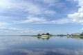 Gorodets,, Russia. - June 2.2016. Mayak Gorodetsky gateway on the Volga River. Reflection of clouds in water.