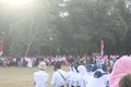 The Indonesian flag lowering ceremony witnessed by villagers. Indonesia Independence Day