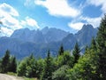 Gosau - Gravelled road in the mountains with the view on high Alps in the region of Gosau, Austria. Royalty Free Stock Photo