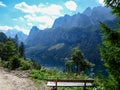 Gosau - Gravelled road in the mountains with the view on high Alps in the region of Gosau, Austria. Royalty Free Stock Photo