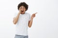 Gosh it is embarrasing. Portrait of shocked excited and emotive good-looking young hispanic male wiht moustache and afro