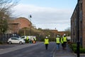 01/29/2020 Gosport, Hampshire, UK A group of builders wearing high visibility clothing and hard hats walking down a street