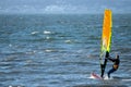 06/09/2019 Gosport, Hampshire, UK A lone windsurfer riding his board over waves