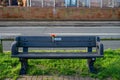 01/29/2020 Gosport, Hampshire, UK A memorial bench with a single flower attached to it