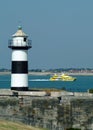 Catamaran and lighthouse Royalty Free Stock Photo