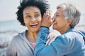 Gossip, outdoor and senior friends with a secret, whisper or talking in ear for a funny joke after beach exercise Royalty Free Stock Photo