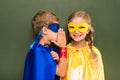 Gossiping pupils in superhero costumes