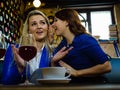 Two women gossiping in pub Royalty Free Stock Photo