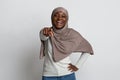 Gotcha. Black Muslim Woman In Hijab Pointing Finger At Camera And Laughing Royalty Free Stock Photo