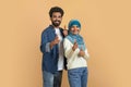 Gotcha. Cheerful Muslim Couple Pointing Fingers At Camera, Indicating Somebody Royalty Free Stock Photo
