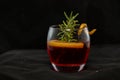 Gotfather cocktail with bourbon whiskey, amaretto, orange wedge and rosemary Royalty Free Stock Photo