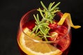 Gotfather cocktail with bourbon whiskey, amaretto, orange wedge and rosemary Royalty Free Stock Photo