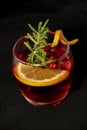 Gotfather cocktail with bourbon whiskey, amaretto, orange wedge and rosemary Royalty Free Stock Photo