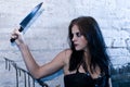 Goth girl holding a knife Royalty Free Stock Photo