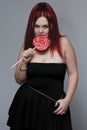 Goth rock red hair chick - lollipop Royalty Free Stock Photo