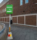 Sign marking smoking zone outside a shopping mall..