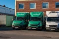 Two green Budbee delivery vans Royalty Free Stock Photo