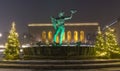 Gothenburg Sweden. circa December, 2021: Poseidon sculpture and Christmas trees at GÃ¶taplatsen Royalty Free Stock Photo