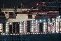 Shipping containers being loaded on container ship Munich Maersk..
