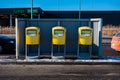 Three yellow Postnord mailboxes in a row Royalty Free Stock Photo