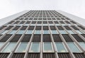 Looking up tall glass and concrete office high-rise building Royalty Free Stock Photo