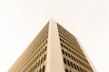 Looking up tall glass and concrete office high-rise building Royalty Free Stock Photo