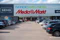 Large parking lot outside a mall with Nordic Wellness and Media Markt..