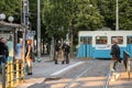 Ticket inspectors at a tram stop..